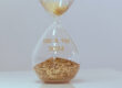 An hour glass with the words 100 x 100 2024- A campaign for Weld Women to Women